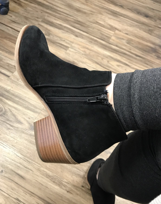 A reviewer wearing the black booties