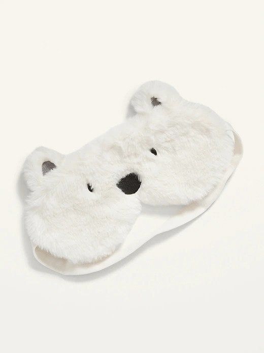 A sleep mask designed to look like a playful polar bear, perfect for kids or the young at heart.