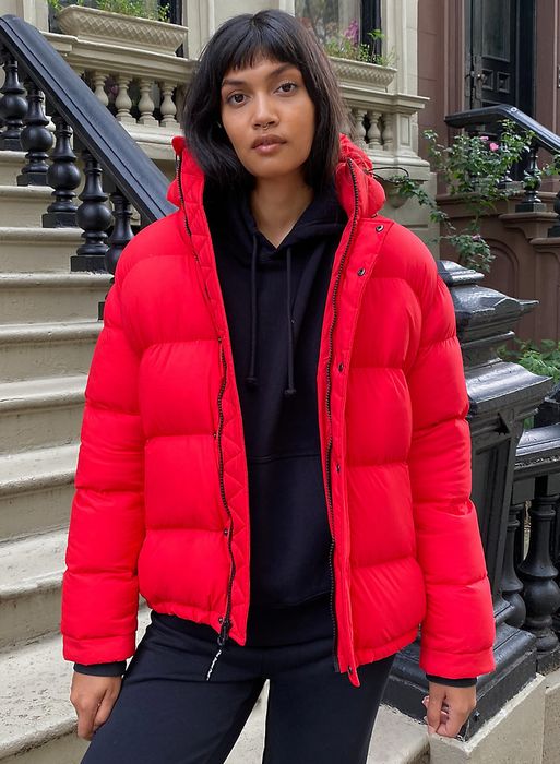 A model wearing the red puffer jacket