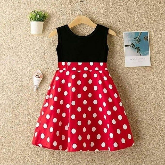 A red and white polka dot skirt paired with a black sleeveless top, displayed for shoppers.