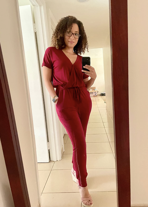 reviewer wearing the red jumpsuit