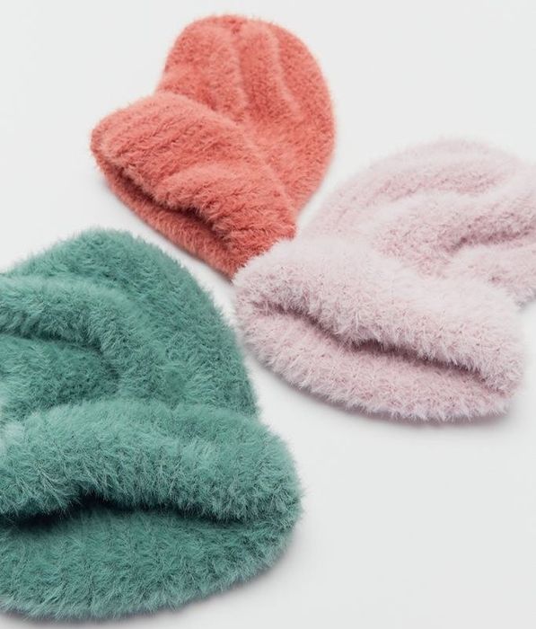 the beanies available in shades of blue, purple, and pink