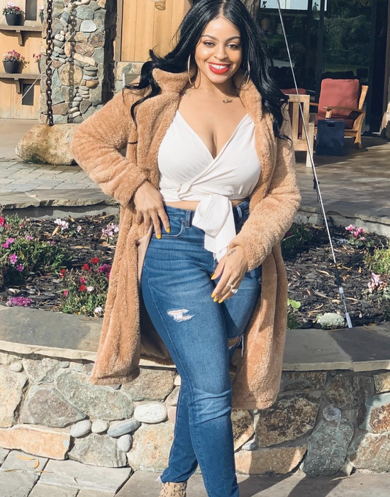 reviewer wearing the light brown cardigan coat