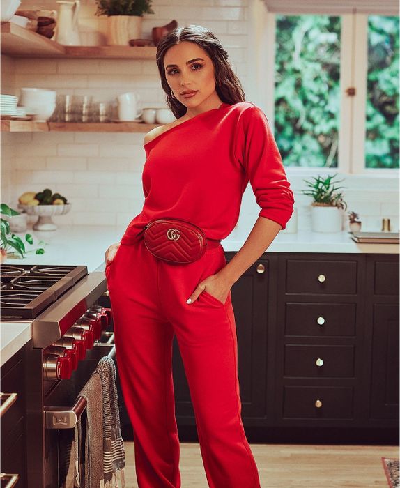 A model wearing the sleeved off-shoulder top