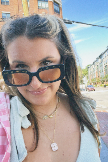 Ali wearing the ‘Talk to Me Nice or Not at All’ black sunglasses