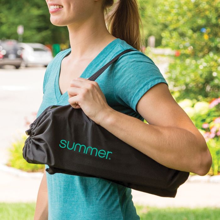 A model showcasing a shoulder sling carrying bag