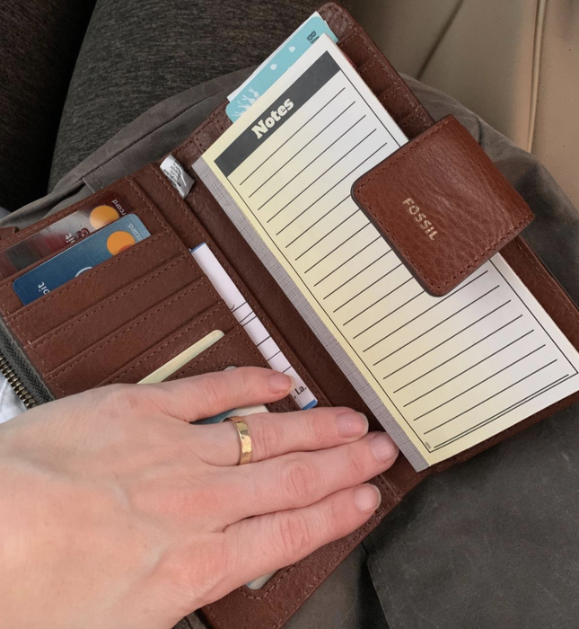 A reviewer photo of the wallet with a notepad inside