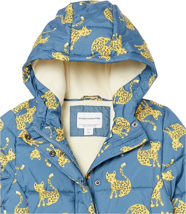 A blue winter coat for kids featuring a bold leopard print design