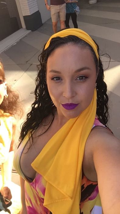 Reviewer wearing the vibrant purple shade
