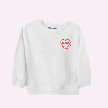 A white toddler sweatshirt featuring a custom heart design