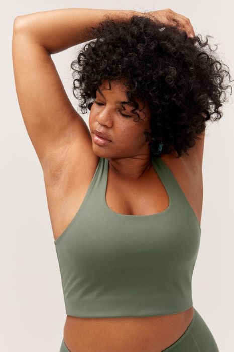 A model wearing the green sports bra