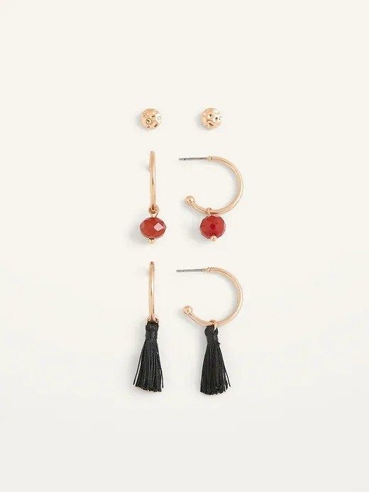 A collection of gold stud earrings, red stone earrings, and black tassel earrings displayed side by side.