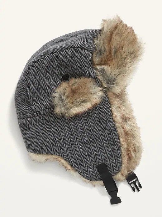 A grey trapper hat with light brown faux-fur lining.