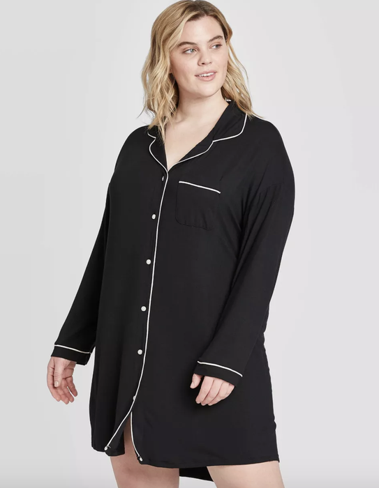 A model wearing a black sleeved button-down