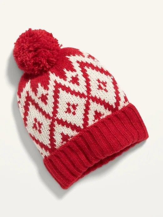 A red and white hat with a fluffy pom-pom at the top.