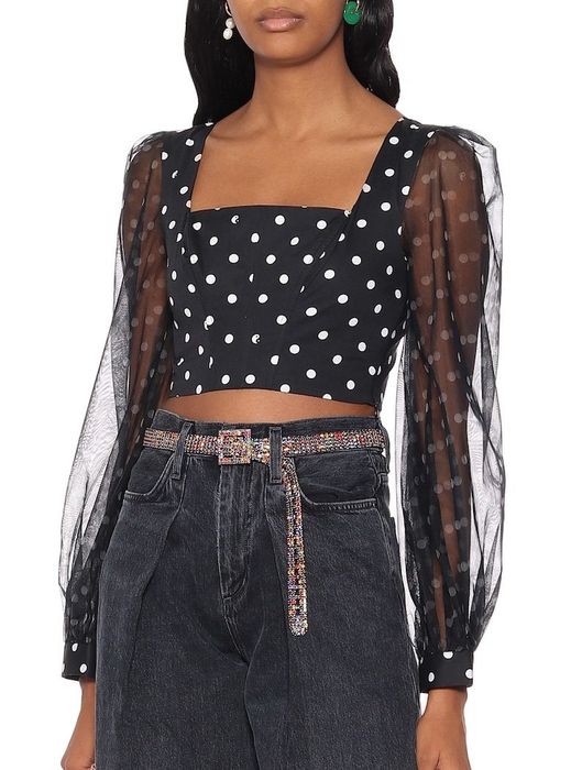 A model wearing the polka dot top