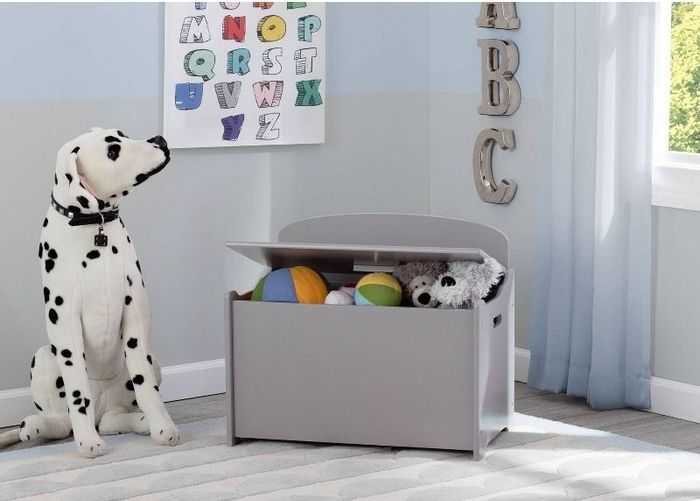 a gray toy box packed with toys