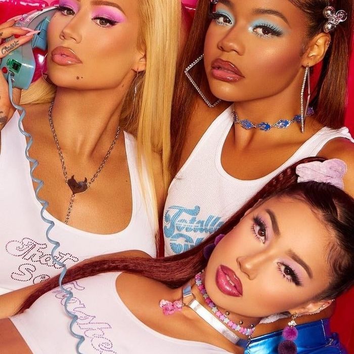 Three models showcasing eyeshadow looks: one using the pink palette, one the blue, and one the purple