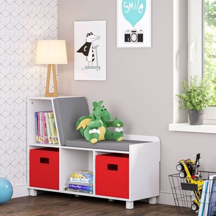 a reading bench and bookshelf in a room