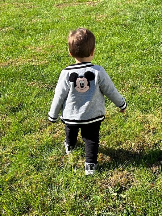A Mytour editor’s son wearing a bomber jacket with Mickey embroidered on the back