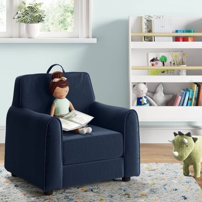 a doll seated in a chair