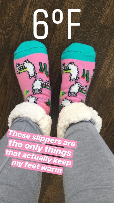 My feet in the socks, cuffed to reveal the sherpa lining, with text indicating it was 6 degrees Fahrenheit at the time of the photo and stating,