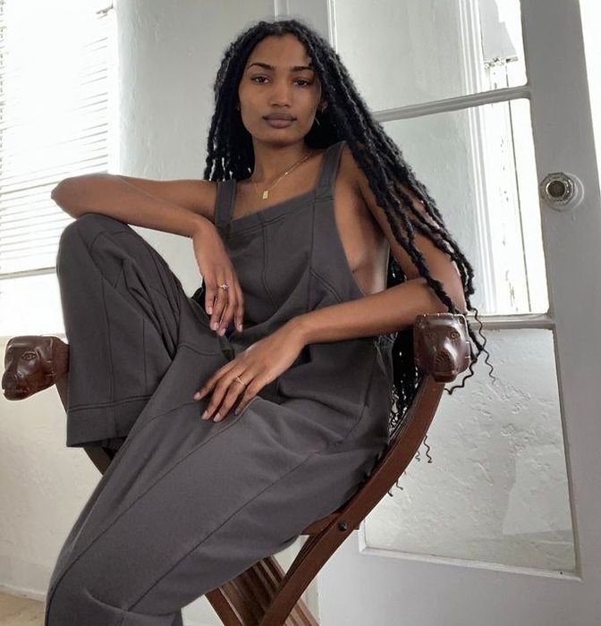 A model wearing a charcoal square-neck jumpsuit