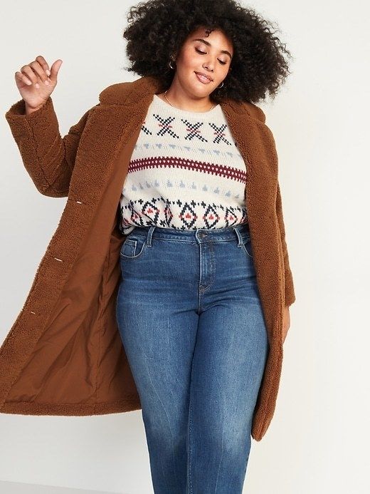 A model wearing the warm brown teddy coat