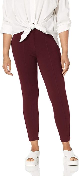 A model wearing burgundy leggings