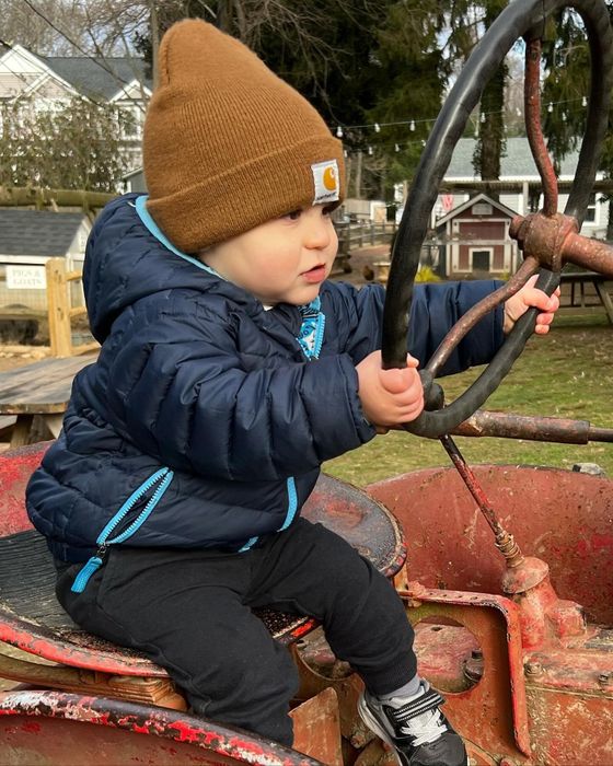 The Mytour editor’s son wearing a stylish dark tan Carhartt beanie