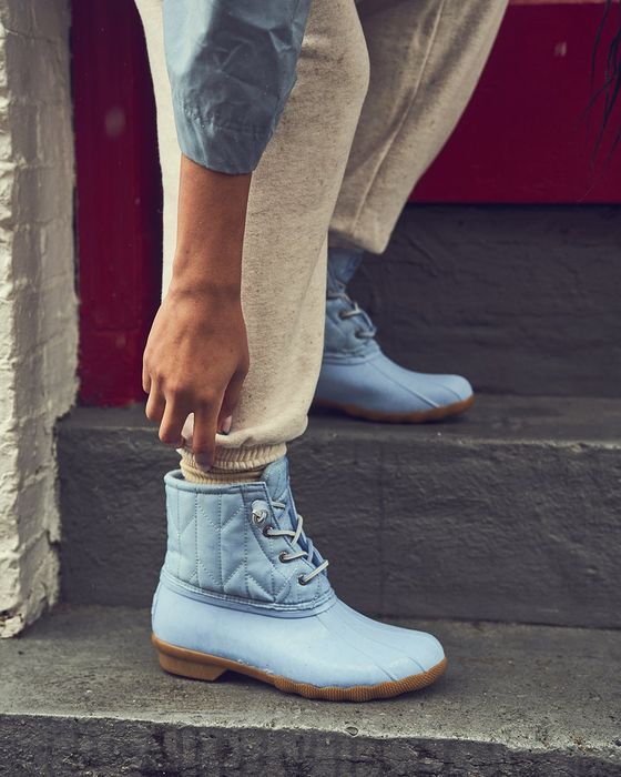 model wearing light blue saltwater duck boots