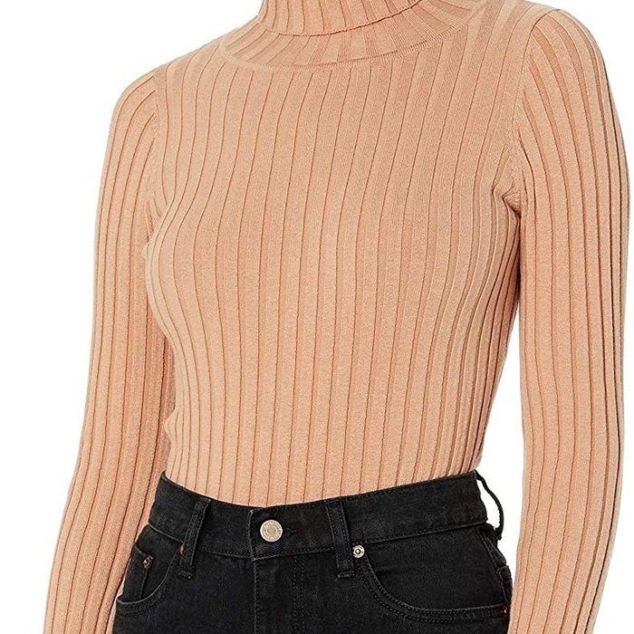 A model wearing the tan turtleneck
