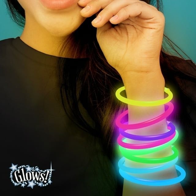 A person wearing glowing bracelets on one arm, with text highlighting the product feature: 