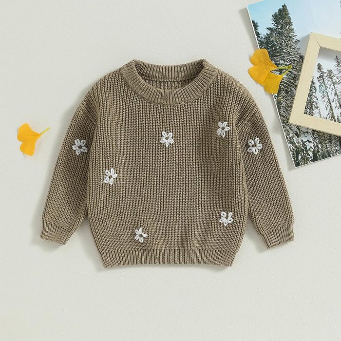 A khaki oversized baby sweater featuring delicate embroidered flowers