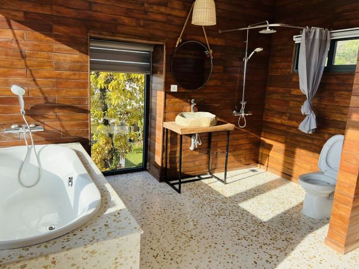 A bottle of Purell hand sanitizer with lavender scent, highlighting that it kills 99.99% of germs