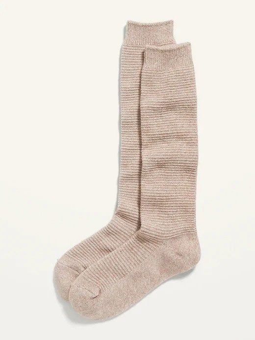 A pair of beige boot socks that offer both style and comfort.