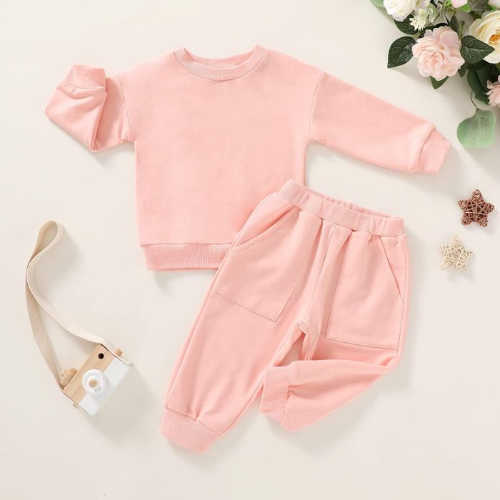 A matching pink sweatshirt and sweatpants set