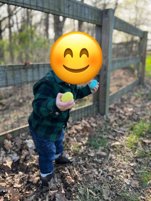 A reviewer’s child wearing a green flannel shirt