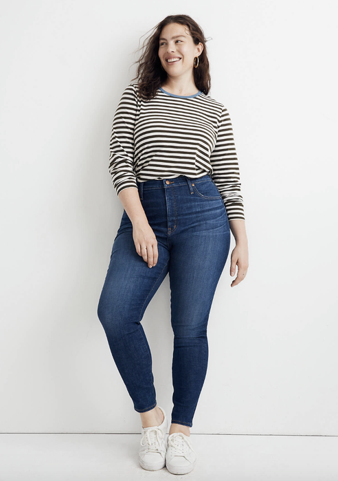 A model showcasing the dark blue jeans