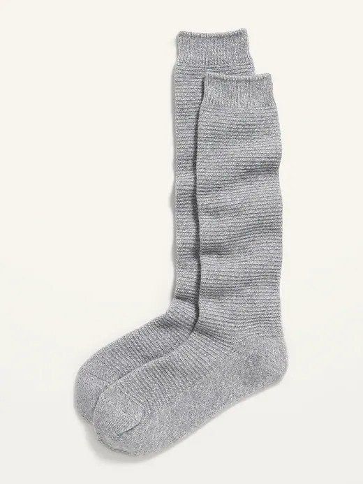 A pair of grey boot socks, perfect for adding warmth and flair to your winter wardrobe.