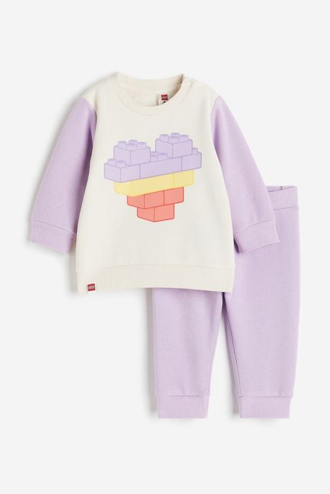 A lavender sweat set with a cute LEGO brick heart design on the sweatshirt