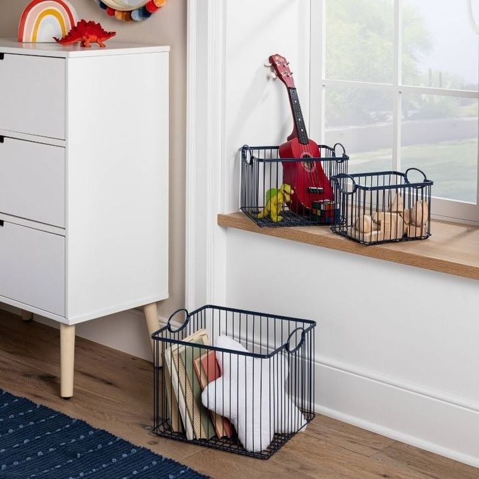 a set of storage bins filled with toys