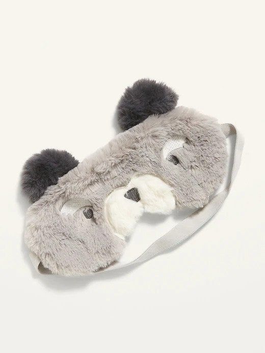 A sleep mask designed to look like an adorable grey puppy with a white nose, perfect for animal lovers.