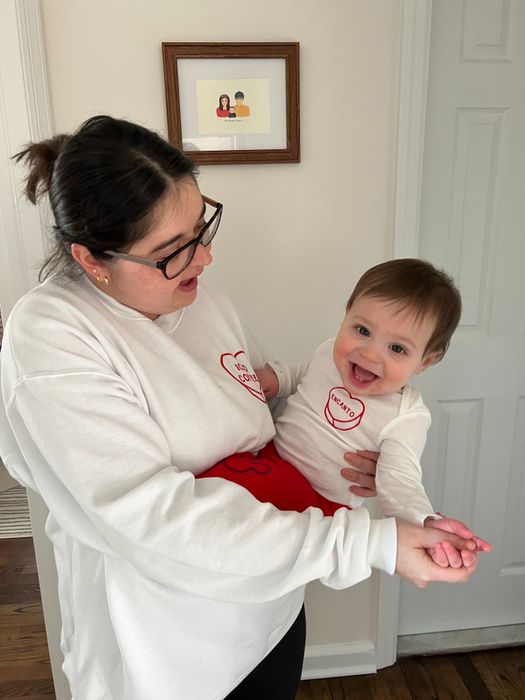 A Mytour editor and her son wearing matching white sweatshirts with personalized hearts