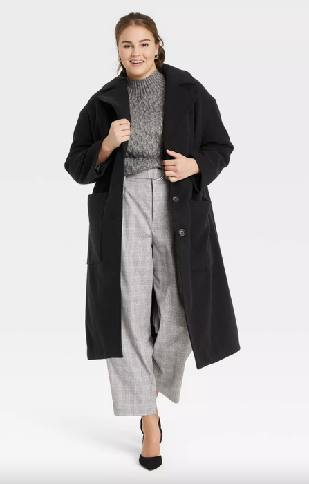 model wearing the black coat
