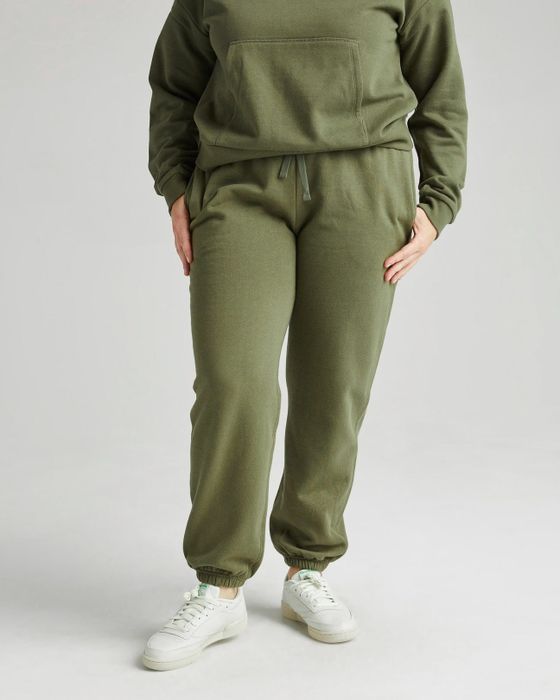 model showcasing the green sweatpants