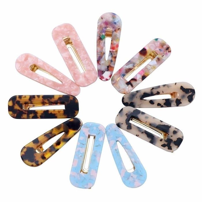 a variety of hair clips in different styles and colors