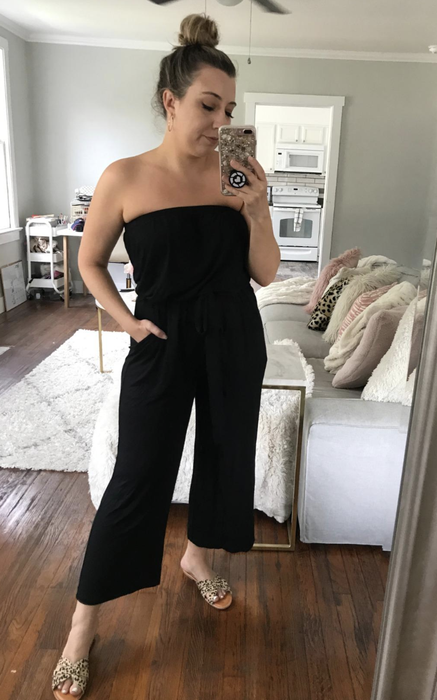 reviewer wearing the black jumpsuit