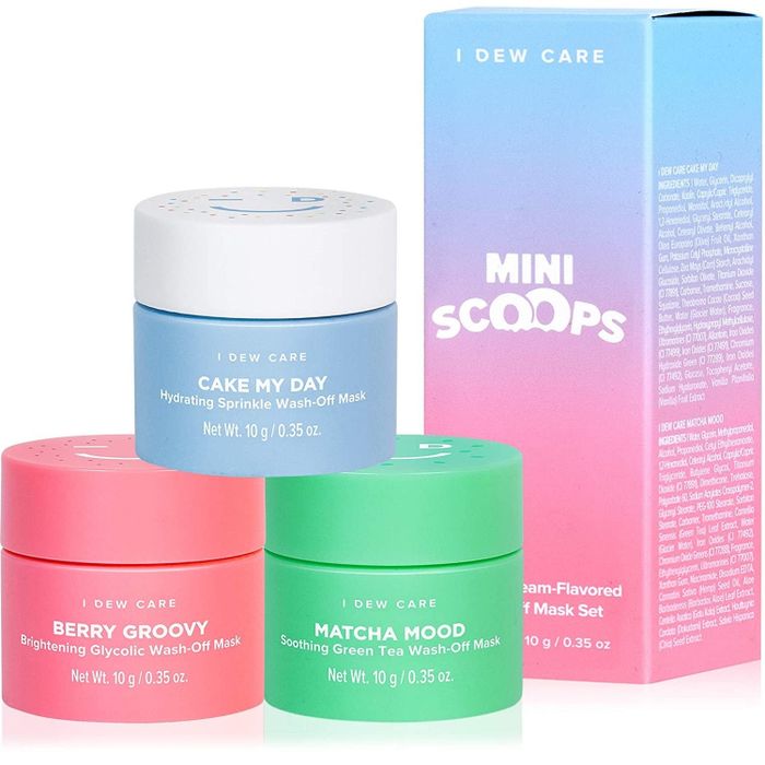 The three masks in the set placed beside their packaging