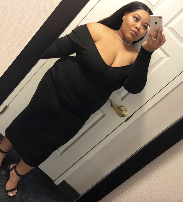 reviewer showcasing the black dress